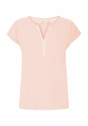 Gaiši rozā īsām piedurknēm tunika ar V-veida kaklu, priekšējo kabatu un teksturētu pogu rindu. Izgatavota no mīkstas, elpojošas auduma.