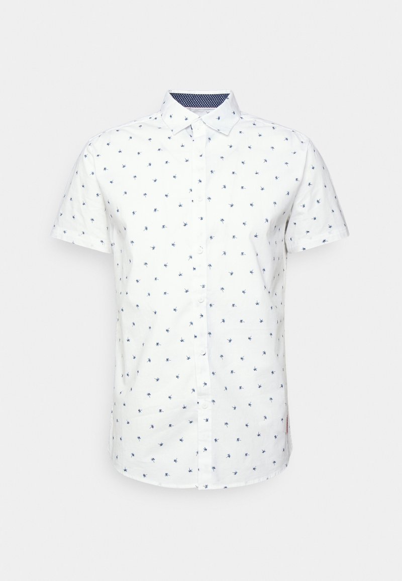 Chemise blanche à manches courtes avec petits imprimés de palmiers bleus et col pointu sur fond uni.