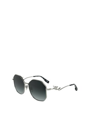 Occhiali da sole ottagonali con lenti nere sfumate, montatura in metallo argento e braccia in filo uniche con una texture a motivo bianco e nero.