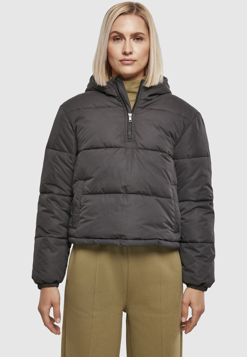 Pufferjakke i mørkegrå, cropped design med hætte, halvlange lynlås, elastiske manchetter, med quiltet, polstret tekstur.