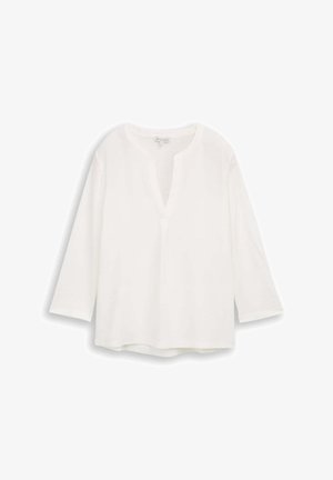 Witte, langmouwige blouse met een V-hals en een rechte zoom. Gemaakt van zachte stof met minimale stikseldetails bij de halslijn.