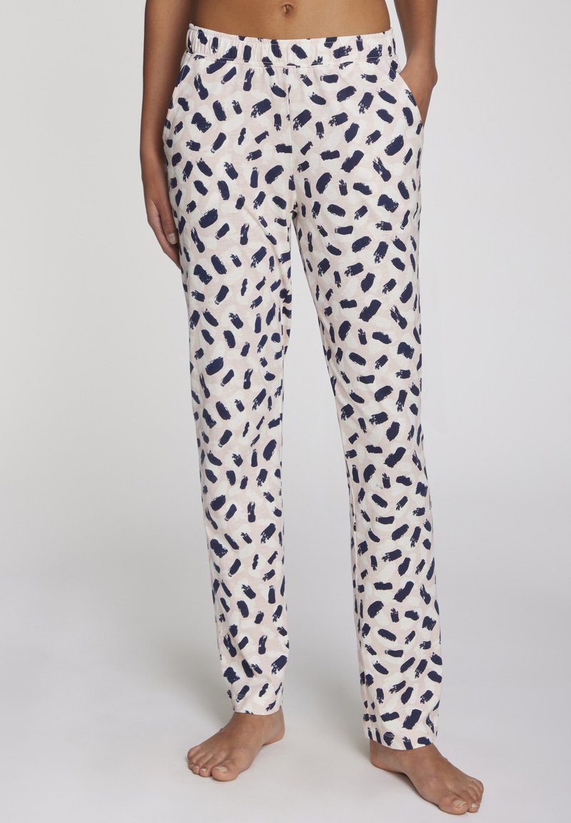 Pantalones de pijama ligeros en color crema con un patrón abstracto en azul marino. Cuentan con una cintura elástica y bolsillos laterales. Corte recto y relajado.