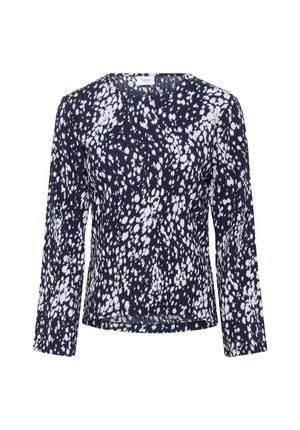 Haut bleu marine à manches longues avec un motif de points blancs irréguliers. Doté d'un col rond et d'une texture élastiquée sur les côtés.