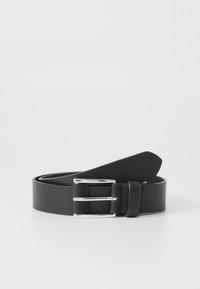 Black leather belt with silver metal buckle, rolled up on a white surface.