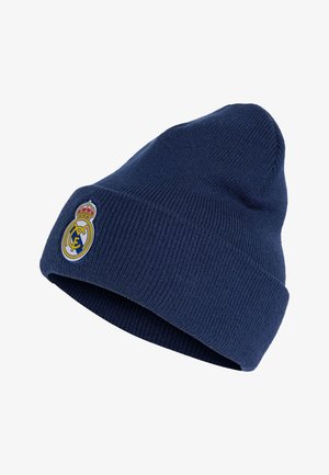 Ciemnoniebieska dzianinowa czapka z podwiniętym rondem, z emblematem klubu piłkarskiego Real Madryt z przodu.