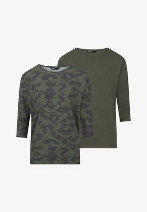 Two green tops: one has a dark green camouflage pattern, while the other is a solid dark green. Both feature a round neckline and three-quarter sleeves.