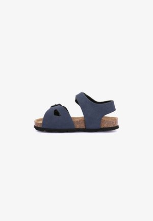 Sandalo blu navy per bambini con punta aperta, cinturini regolabili e sottopiede in sughero su sfondo bianco.