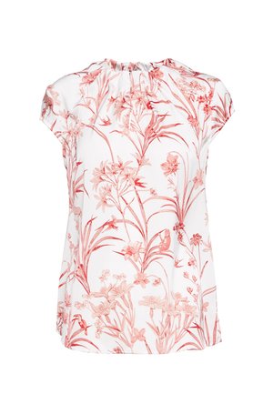 Blouse blanche à manches courtes avec imprimé botanique et animalier rouge comprenant des fleurs, des oiseaux et du feuillage, avec un col froncé.