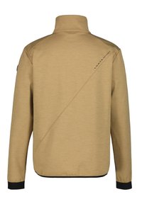 Chaqueta beige con cuello alzado, mangas largas y puños negros. Presenta costuras diagonales y un logo en negro de "LUHTA SPORT". Textura suave.