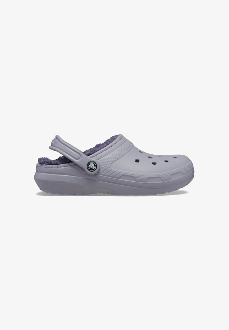 Light purple clog made of rubber, featuring a fuzzy purple lining, ventilation holes, and a sturdy back strap for secure fit.