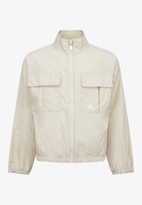 Veste zippée crème en matériau léger, dotée de deux poches avant, de poignets élastiques et d'un détail logo blanc sur la poitrine.