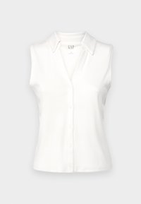 Haut à col blanc sans manches en maille côtelée, taille small, fabriqué par GAP, exposé sur une surface plane.