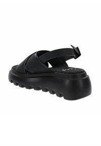 Zwarte platform sandalen met kruisbandontwerp, van rubbermateriaal, met een textuur op de zool en een gevormde voetbed voor comfort. Aanpasbare hielband aanwezig.