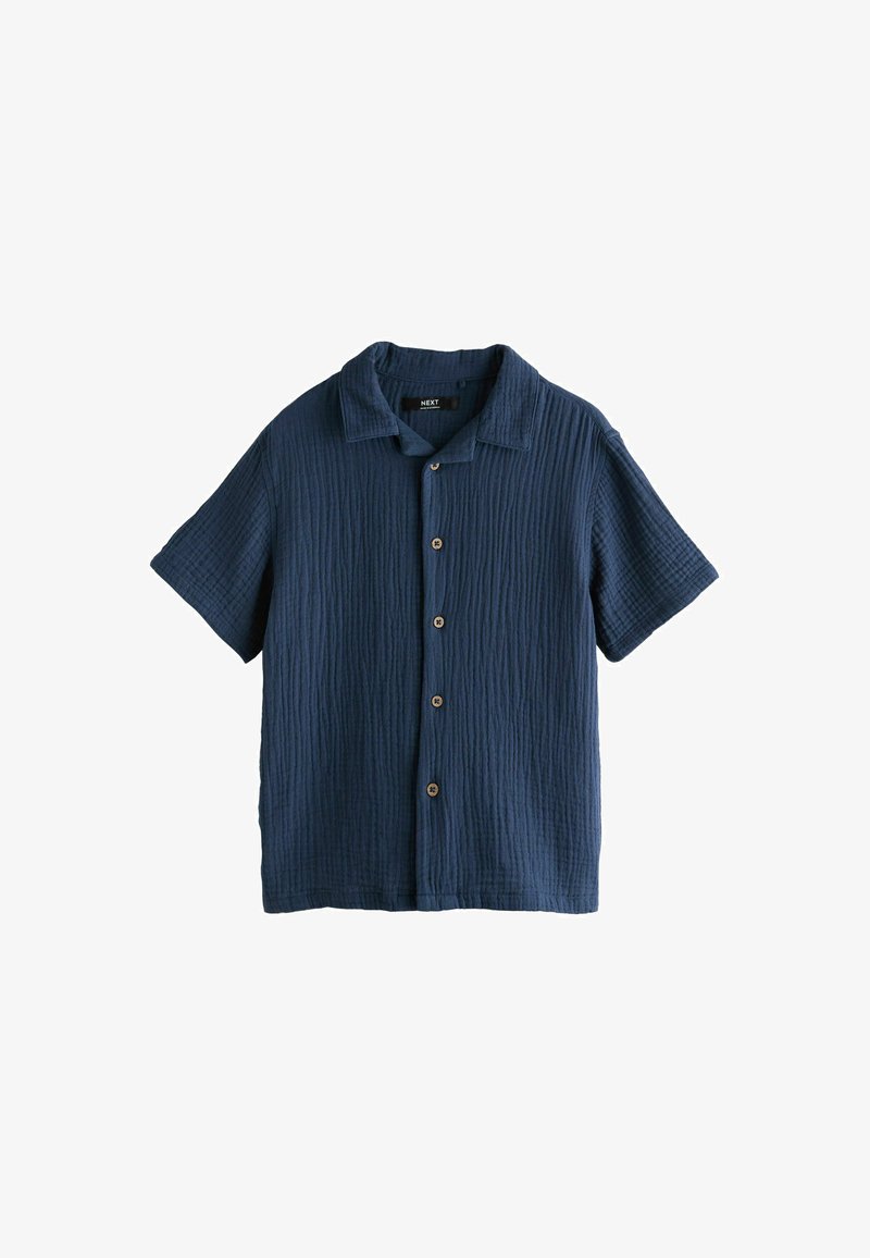 Chemise bleu marine à manches courtes avec boutons, tissu texturé et col, présentée à plat sur un fond blanc.
