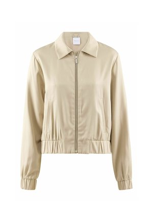 Veste courte beige avec un col montant, fermeture éclair à l'avant, poignets et ourlet élastiques, en tissu lisse avec un léger éclat.
