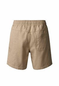 Shorts décontractés beiges avec taille élastique et une poche plaquée unique sur le côté arrière droit, vus de dos.