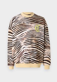 Bomulls sweatshirts med ett brunt och krämfärgat zebra randigt mönster, gul ribbad krage och mudd, samt en broderad logotyp i pastellgrön.
