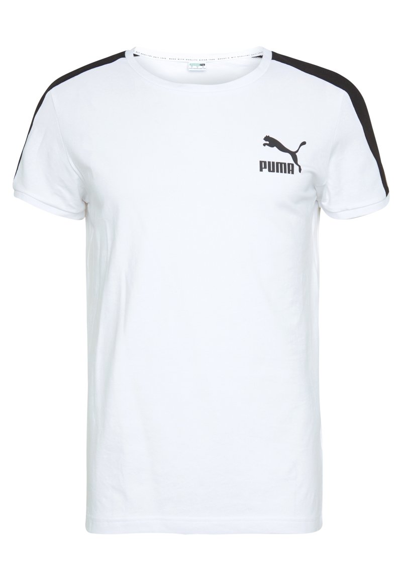 Bílý krátký rukáv tričko s černými akcenty na ramenou. Obsahuje černé logo Puma na levé straně hrudi. Vyrobeno z měkké bavlny.