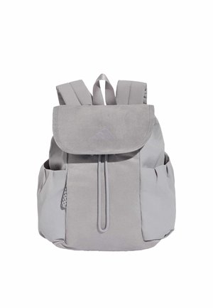 Light gray soft fabric backpack with front flap, drawstring closure, two side pockets, and padded shoulder straps.