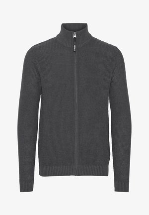 Tumehall hallitus, millel on ribikoe, kõrge krae ja pikad varrukad. Omab esipaneeli tõmblukk ja tekstuuriga kudum.