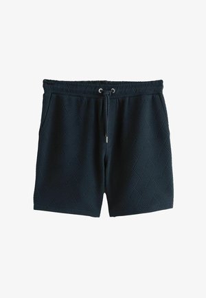Marineblå shorts med et tekstureret fiskebensmønster, der har elastisk talje med snøre og metalender.