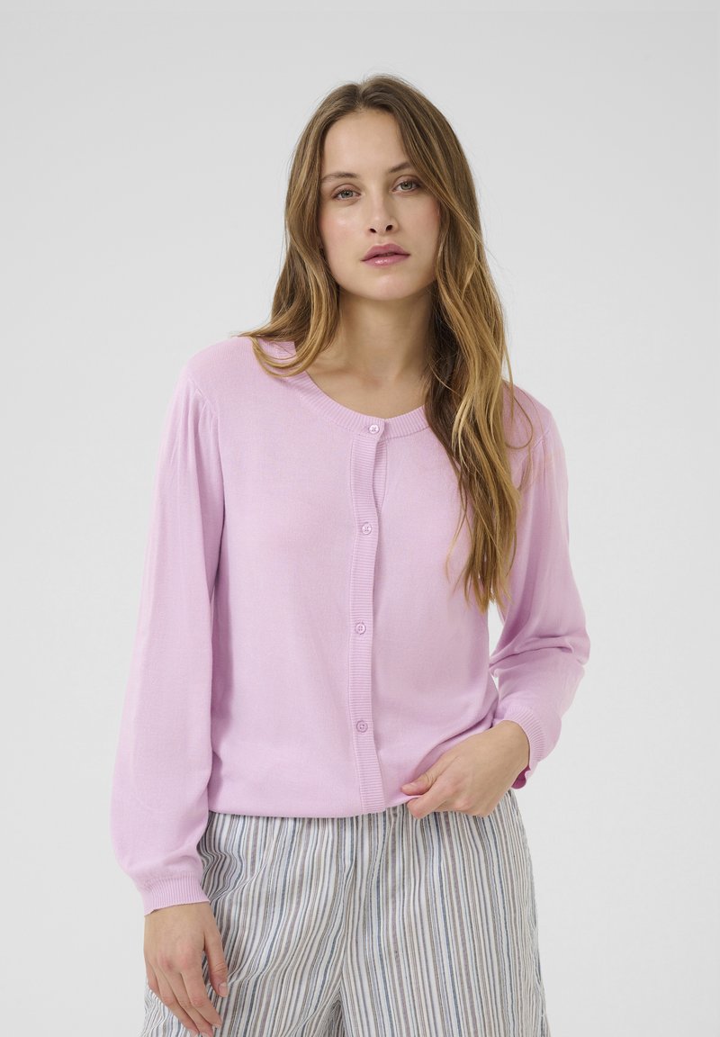 Light pink cardigan sweater with long sleeves and a round neck, featuring a button-down front and soft, smooth texture.
