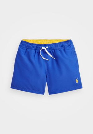 Blue swim shorts with an elastic yellow waistband, white drawstring, and small yellow logo. Made of smooth, quick-drying material.