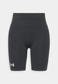 Shorts de compression noirs en tissu lisse et extensible. Dotés d'une taille haute avec le logo "UNDER ARMOUR" et un accent en blanc.