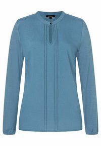 Langarm-Bluse aus weichem, hellblauem Stoff. Mit Rundhalsausschnitt, der ein Schlüsselloch-Detail und Falten entlang der Vorderseite aufweist. Gummierte Manschetten.