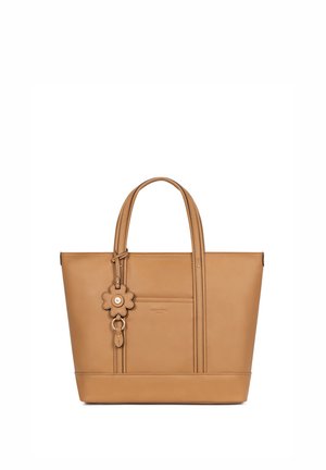 Sac fourre-tout en cuir fauve avec doubles poignées et poche avant, décoré d'un charm en forme de fleur en cuir avec un bouton métallique au centre.