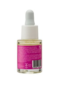 Bottiglia di vetro trasparente con un tappo contagocce bianco e turchese. Contiene olio giallo; l'etichetta presenta uno sfondo rosa con testo e un codice a barre.
