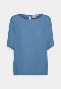 Haut bleu à manches courtes en tissu léger, avec un col rond, une fermeture à boutons à l'arrière et des fentes latérales pour plus de confort.