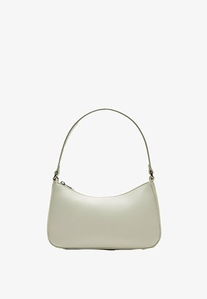 Sac hobo en cuir beige clair avec une silhouette incurvée, une bandoulière fine et une fermeture éclair sur le dessus. Texture lisse avec des accents minimaux.