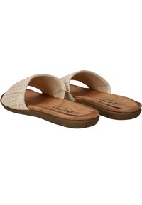 Sandales ouvertes de couleur beige clair dotées d'un matériau supérieur tissé, d'une semelle intérieure rembourrée et d'une semelle en caoutchouc avec une texture antidérapante.