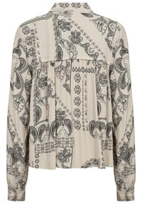 Blus med lång ärm i krämfärgad tyg med svarta paisley- och blommönster. Har en krage, plisserad bak och knappade manschetter.