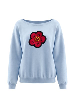 Felpa azzurro chiaro a maniche lunghe con polsini e orlo a costine, con una grande toppa a forma di fiore rosso con puntini gialli al centro sul petto.