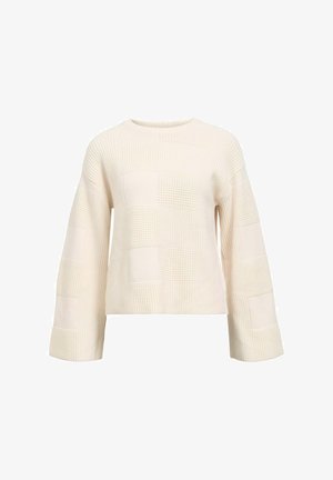 Cream knit sweater featuring a textured checkered pattern, wide bell sleeves, and a round neckline. The fabric has a soft, cozy appearance.