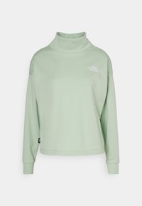 Sudadera de cuello alto en verde menta, hecha de tela suave, con mangas largas, un corte relajado y un logo ligero en el pecho.