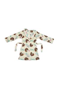 Kindermantel van lichtbeige fleece, met cartoonhondafdrukken en zinnen als "Zo Schattig!" en "Paw Patrol!", met een capuchon en een strikceintuur.