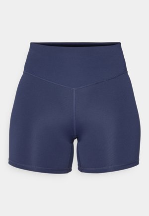 Pantalones cortos deportivos azul marino hechos de material elástico con una cintura alta, que presentan costuras sin costura y un diseño ajustado.