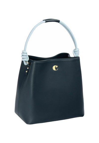 Navy leather handbag with a curved light blue handle featuring a knotted detail, gold logo accent on the front, and open-top design.