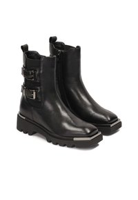 Black leather ankle boots with pointed toes, featuring two decorative metal buckles and a thick, lugged sole with a metallic accent.