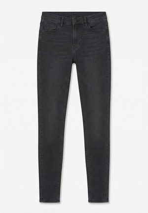 Jean slim noir avec poches avant et arrière, fermeture éclair et bouton, présenté à plat sur un fond blanc.