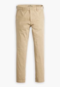 Chinos beiges en coton, avec une coupe droite, des poches avant et une fermeture à bouton. Texture lisse avec des coutures minimales.