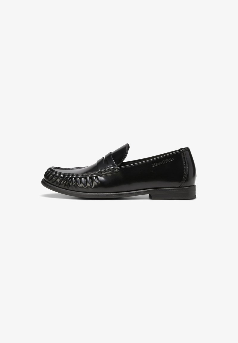 Black leather loafers with a smooth, shiny surface, rounded toe, and decorative stitching along the edges. Flat rubber sole with minimal tread.