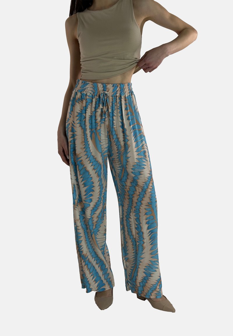 Lätta, mönstrade palazzo-byxor i blått, beige och brunt. Har ett elastiskt midjeband och en avslappnad passform, perfekt för vardagsbruk.