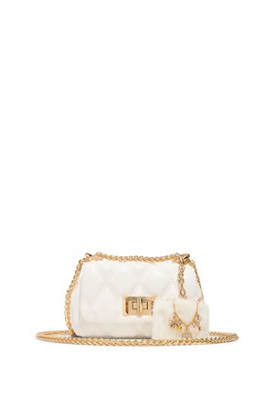 White quilted handbag made of leather, featuring a gold chain strap, a lock closure, and a puff charm with embellishments attached.