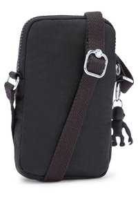 Borsa a tracolla nera in tessuto con chiusura a zip, tracolla regolabile e un piccolo portachiavi di una scimmietta nera attaccato. Superficie testurizzata.