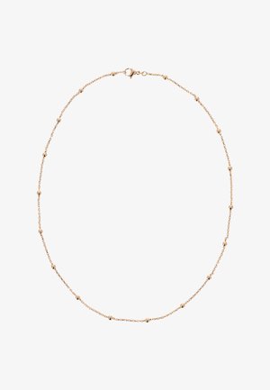 Fin guldkæde med små jævnt fordelte runde perler og en lås med hummerlås mod en hvid baggrund.