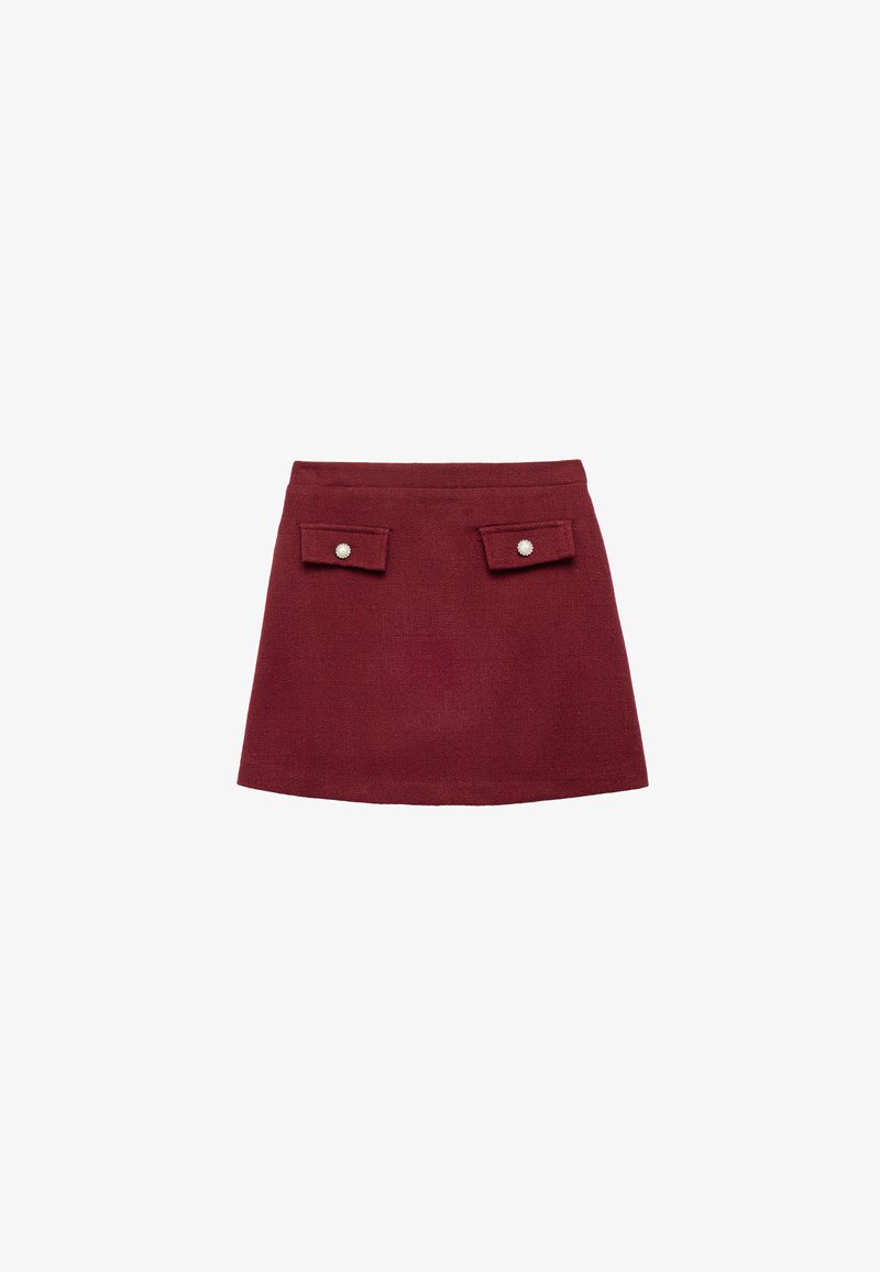 Burgundy mini skirt with two front pockets, each adorned with a decorative button. Made from textured fabric, featuring a fitted design.